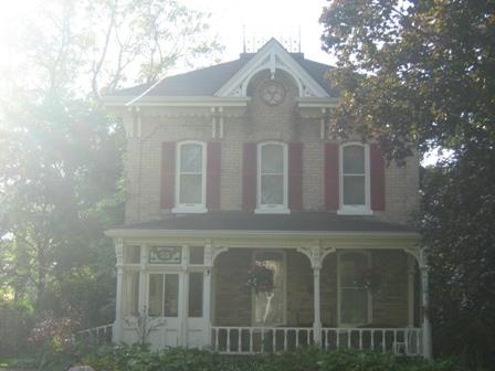 Of note is the open pediment with bullet window and bargeboard finial.; Martha Fallis, 2008.
