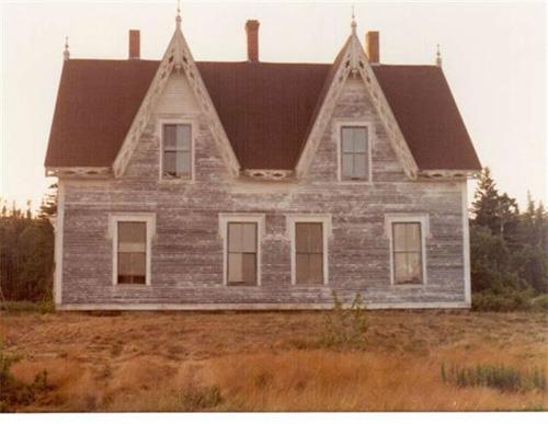 The Isaac Newton House in a state of disrepair before extensive restoration.; Dale Brown