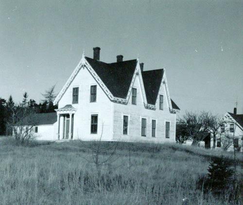 This undated image shows the ornate entrance located on the side of the building.; Grand Manan Historical Society
