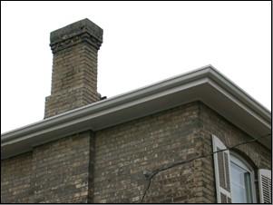Featured is the cornice and the corbelling on the chimney.; City of Brantford, nd.