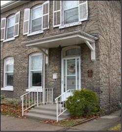 Featured is the main entrance canopy and the double hung windows.; City of Brantford, nd.