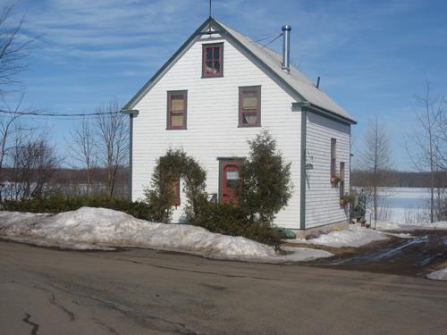 This image shows the front façade of the residence; Village of Gagetown