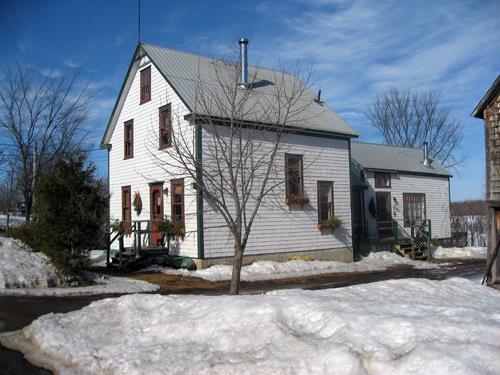This image shows the side view of the residence along with the 1922 extension at the rear of the building; Village of Gagetown