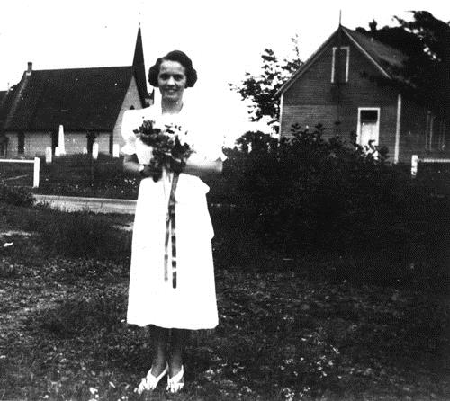 This circa 1934 image shows the Orange Hall Museum on its original site across the road from its current location; Queens County Heritage Collection
