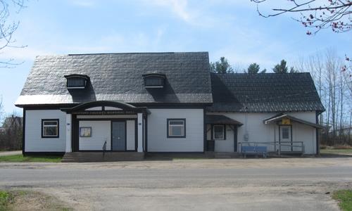 This image shows the contextual view of the building; Village of Gagetown