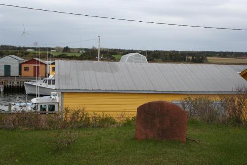 Showing sandstone marker near cairn; Province of PEI, Donna Collings, 2009