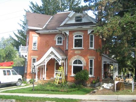 Of note are the original verandas on the facade and west elevation.; Martha Fallis, 2008.