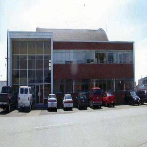 Northern facade of the Harbour Air Hangar, Building T-018, showing its simple geometric form, generous massing and horizontal emphasis, 2006.; Commonwealth Historic Resource Management Ltd., 2006.