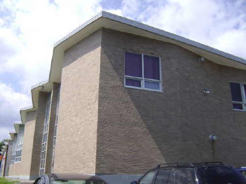 This photograph illustrates the triangular projections of the front façade and cornice, 2009; Town of St. Andrews