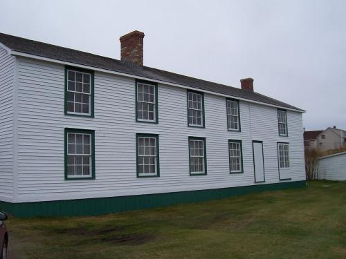 View of the front facade of Ashbourne Longhouse, Twillingate, NL. Photo taken 2004. ; HFNL/Andrea O'Brien 2010