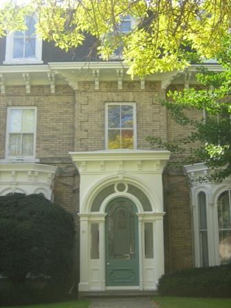 Featured is the frontispiece with detailed covered main entrance.; Martha Fallis, 2008.