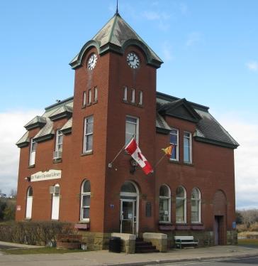 Originally built as a post office and drill hall, the building later served as a pharmacy before opening as a public library.; Doris E. Kennedy