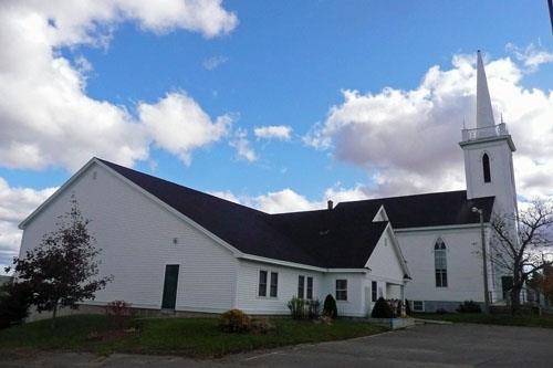Image of the church, viewed from the northwest with the Fellowship Centre, constructed in 2000, extending northward; Village of Hillsborough