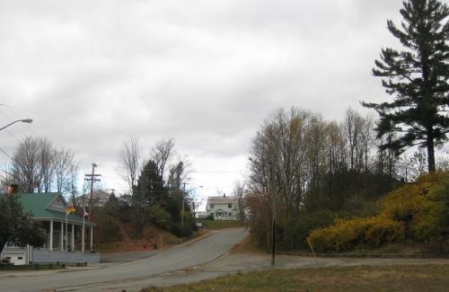 Burial site of the founders of Hartland, William Orser and his wife, Mary Blake-Craig-Orser, on their original land grant. It overlooks the Hartland Town Hall. The large pine tree helps locate the tombstone of the founder and is a significant landmark.; Doris E. Kennedy