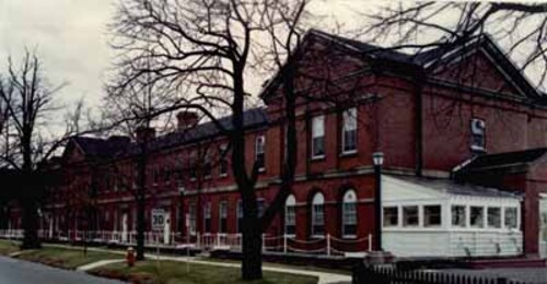 Side view of Wellington House, showing the south façade and the red brick construction.; Parks Canada | Parcs Canada, Canadian Forces, NS-85-6-5687