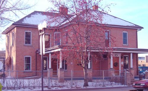 Exterior northeast view of the Parsons Residence from 49th Street, December 19, 2003, currently in use as a law practice office; City of Red Deer, 2003.