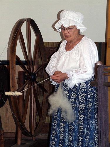 Image showing Betty Adams working the spinning wheel; Village of Dorchester