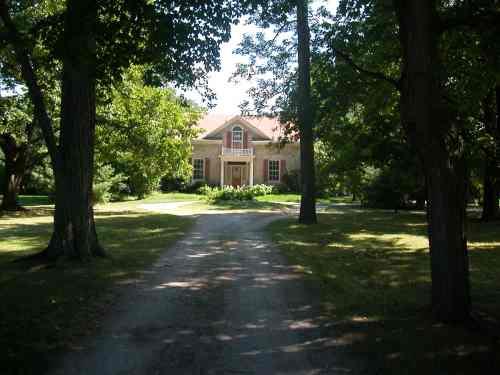View from the tree lined drive.; RHI 2009