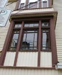 Image of the William Baxter Residence showing the Craftsman details of the porch windows; City of Saint John