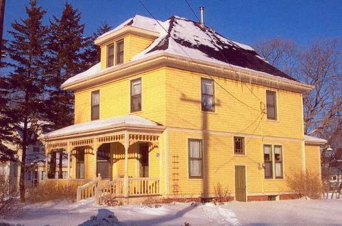 Showing decorative verandah and hipped roof style; Province of PEI