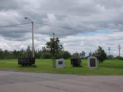 General view of the Historical Sites and Monuments Board of Canada's plaques on the empty field near where the entrances to the mines stood commemorating the Springhill Coal Mining site, 2010.; Parks Canada Agency / Agence Parcs Canada