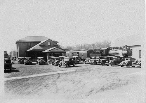 Image of the York Street Train Station showing rolling stock and cars parked in the railway yard, taken circa 1940's; Private Collection