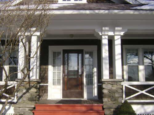 This photograph illustrates the entranceway and the wooden pillars upon their stone bases, 2009; Town of St. Andrews