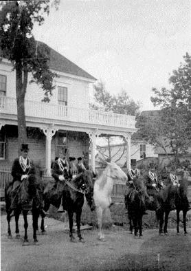 Street scene in Hillsborough circa 1907 looking southeast. Orange parade forming up in front of Captain Wood's house.; Village of Hillsborough