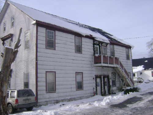 This photograph shows a contextual view of the old school, 2009; Town of St. Andrews