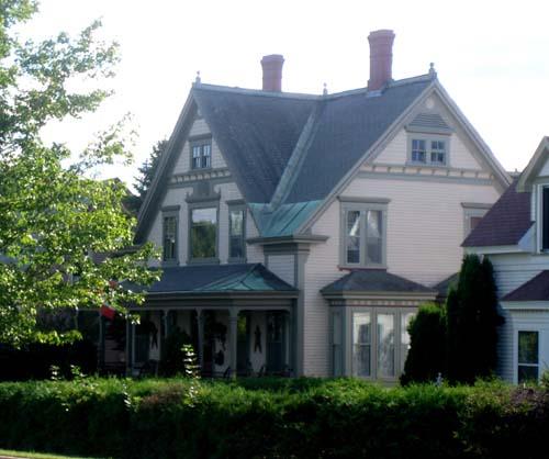 Side view of Hatt House showing projecting bay windows on the first level; City of Fredericton