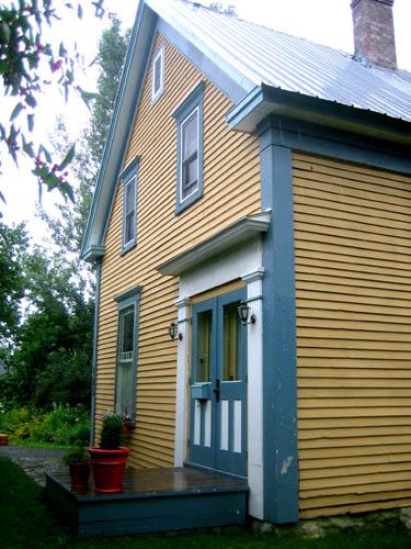 View of wood-frame dwelling, showing double five-panel door; City of Fredericton