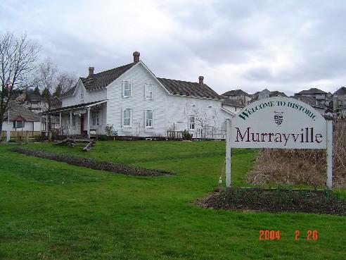 View of Traveller's Hotel looking east from Murray's Corners, February 2004.; Township of Langley, Julie MacDonald, 2004.