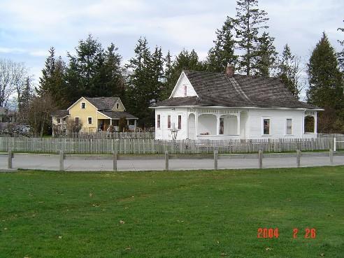 Context view of the Harrower House behind its neighbour the Lamb/Stirling House.; Township of Langley, Julie MacDonald, February 2004.