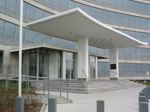 Detail view of the CBC Building, showing the entrance pavilion’s stand-alone, flared white concrete canopy, 2002.; Parks Canada Agency / Agence Parcs Canada, Michel Pelletier, 2002.
