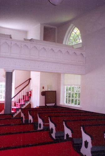Showing interior with decorative balcony; Private Collection