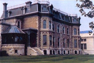 ¾ view of house showing decorative wall features; Parks Canada Agency / Agence Parcs Canada, 2000