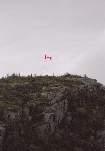 View of flag on top of Peter's Finger, New Perlican, NL. Photo taken 2011. ; © Heritage New Perlican 2011