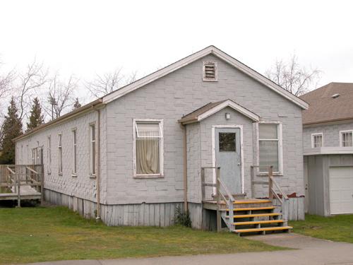 Exterior view of the Army Huts, 2004, view 1; Derek Trachsel, District of Saanich, 2004