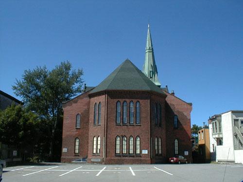This image illustrates the neo-Gothic design influences of the church reflected in its limestone and brick exterior composition; PNB 2004
