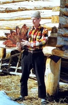 Knut Lang is carrying muskrat pelts.; Curtis Merrill/NWT Arcives/N-1992-192:0038