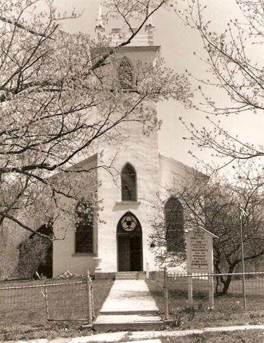 Front façade showing pointed-arch windows and stained glass transom, n.d.; St. Paul's Anglican Church