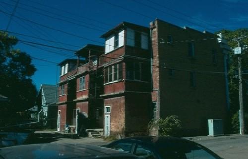 View of enclosed verandas on rear of building, 1988.; Government of Saskatchewan, Frank Korvemaker, 1988