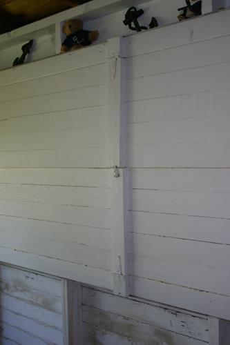Porch interior showing double shudders, Maryville Cottage, Gimli 2013; Historic Resources Branch, Manitoba Tourism, Culture, Heritage, Sport and Consumer Protection, 2014