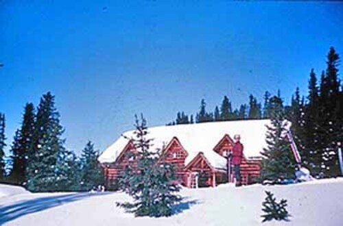 Panoramic view of the Skoki Ski Lodge showing its relationship with, and viewscapes to and from: the Skoki Valley, the surrounding mountain peaks, and the backcountry of Banff National Park, 1965.; Parks Canada | Parcs Canada, 1965