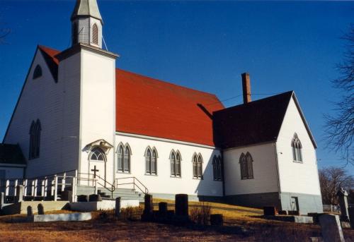 Exterior photo of the South facade of St. James Anglican Church, Carbonear, circa 1999.; HFNL 2006