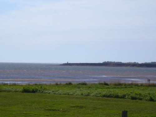 Light with Confederation Bridge in background; Province of PEI, C. Stewart, 2012