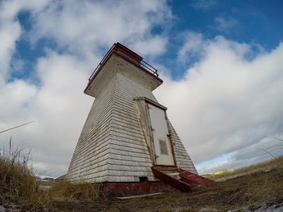 Corner view of the lighthouse rear showing the door leading to the lantern; Agence Parcs Canada | Parks Canada Agency, Luc Miousse, 2015.
