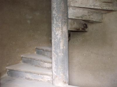 Detail of Bois Blanc Island Lighthouse showing its internal layout with a central stone stairway within the shaft; Parks Canada Agency | Agence Parcs Canada, J. MacLeod