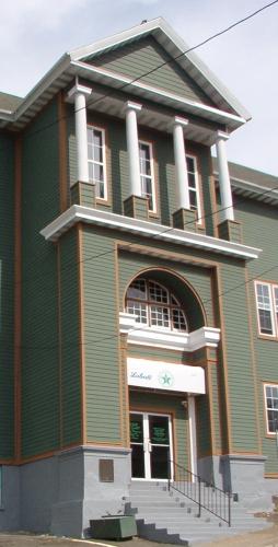 Detailed view of the tower located on the main facade, Star of the Sea Hall.  Photo taken summer 2004.; HFNL 2004
