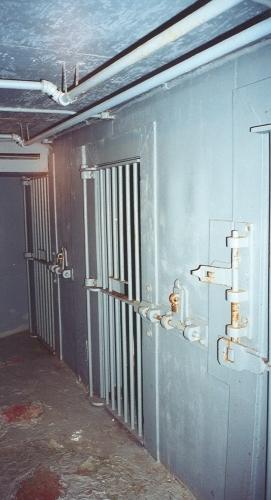 Interior photo showing jail cells, St. George's Courthouse, NL.  Cells were used to hold prisoners when making court appearances.  Photo taken around 2004, prior to restoration.; HFNL 2006